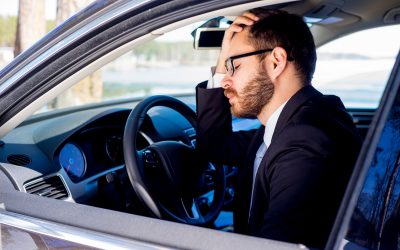 Portrait of a tired man sitting in his car